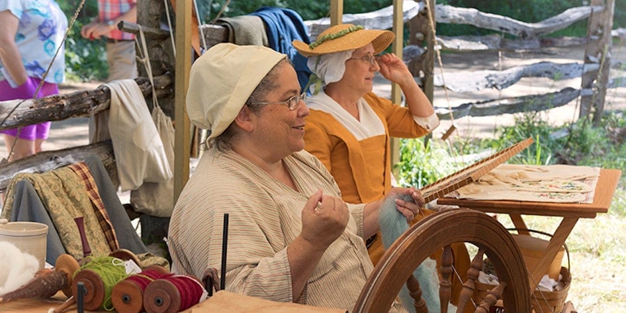 My Life as a Revolutionary War Reenactor Demonstrating How to Spin Yarn Image